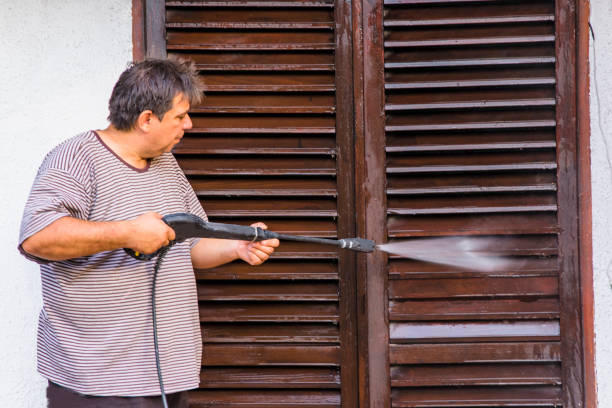 istock Man Cleaning House with Water Spray 1064879416