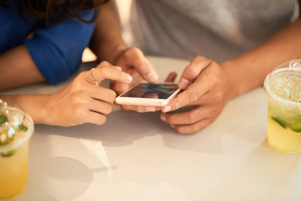 istock Couple checking social media 1064881488