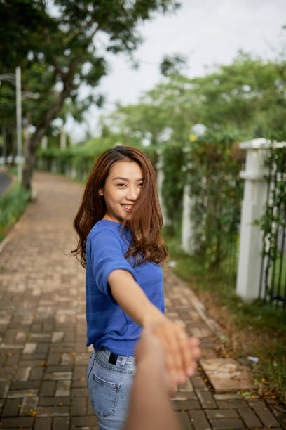 istock Couple walking in park 1064881502