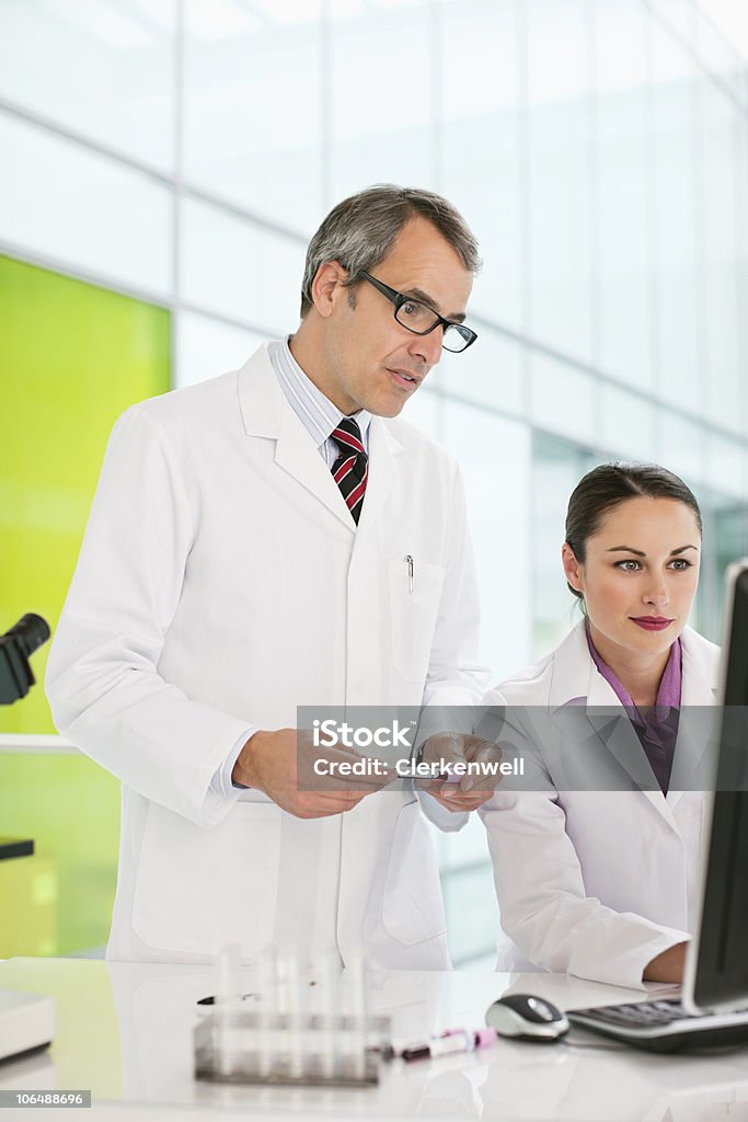 Two people doing research work on computer in laboratory  Computer Mouse Stock Photo