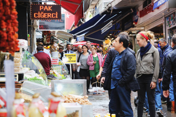 Aydın, Turkey - July 15, 2020: Tourists and local people in the market area downtown in the late afternoon in old castle kuşadası aydın turkey in summer.