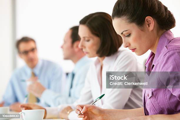 Serious Business Executives At Board Room For Meeting In Office Stock Photo - Download Image Now