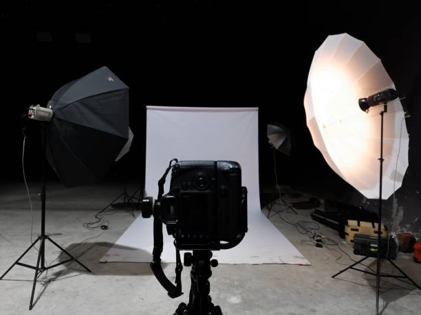 istock Lighting to shoot in the studio. There is a white scene in the black room. 1064888636