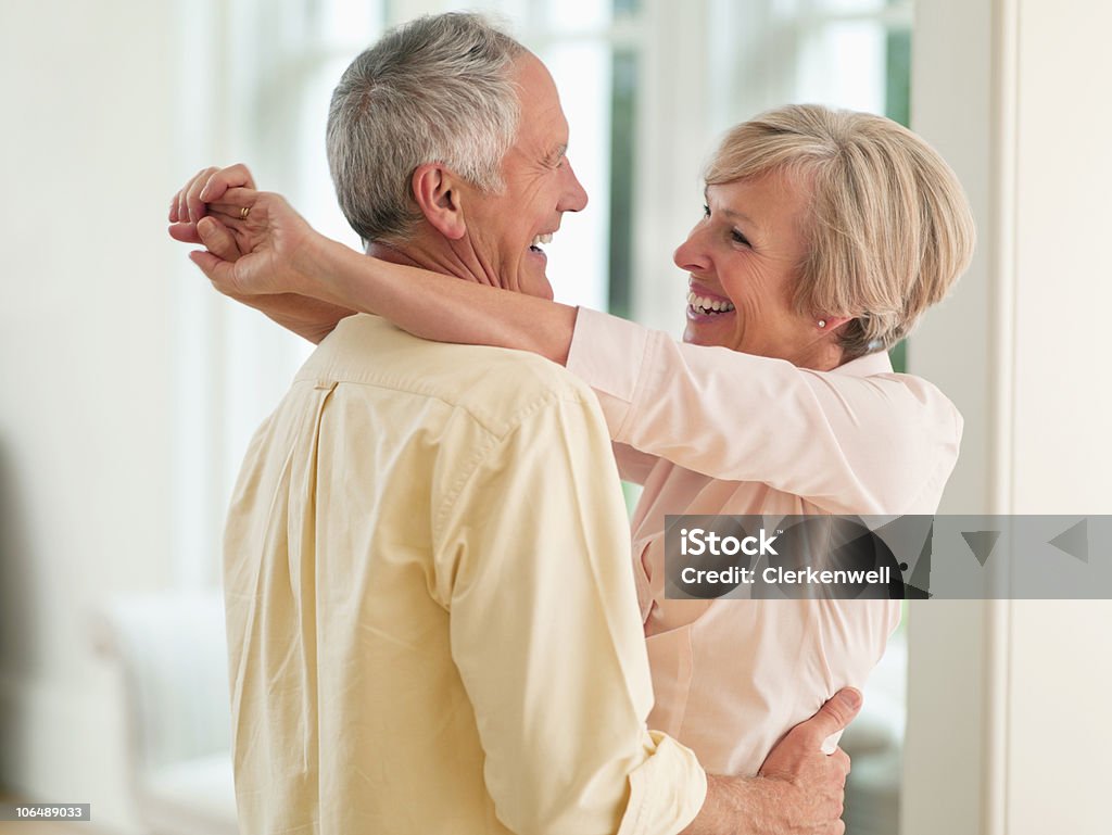 Couple hugging each other, smiling  55-59 Years Stock Photo