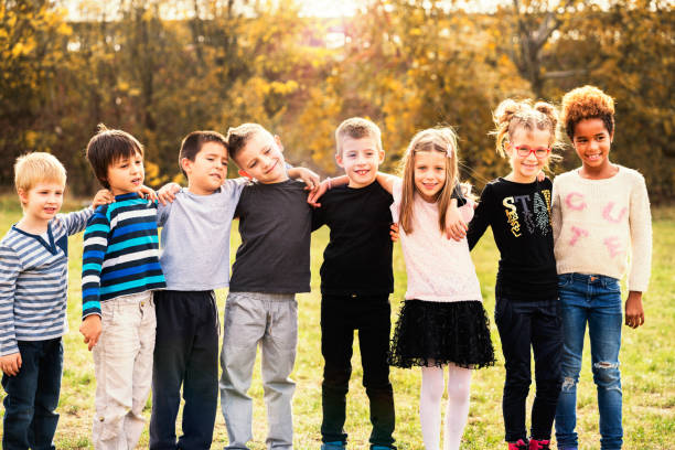 istock Happy kids running on meadow 1064896206
