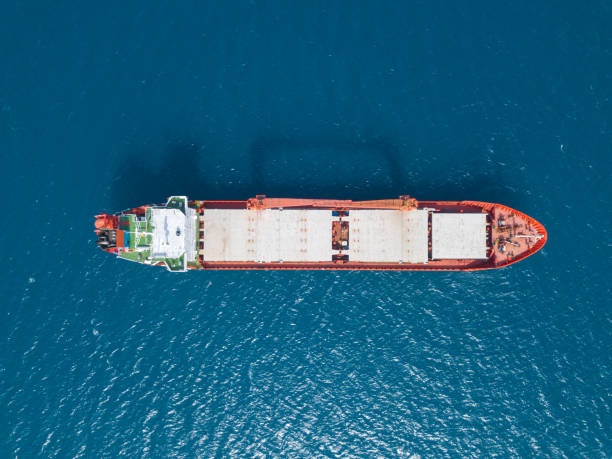 General cargo ship at sea - Aerial image stock photo