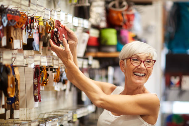 istock Senior woman showing a wall product 1064899068