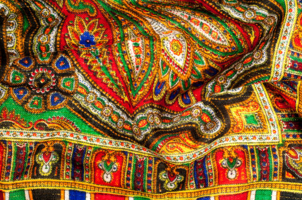 istock Texture, background, pattern. Woman's headscarf, shawl. Bright colors. Paisley. Indian themes. Fabric for clothes Fabric 100% silk. One Fashion Soft Women's Shawl Red Georgette Female Swarf 1064899434