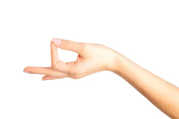 Woman hand showing mudra gesture or holding something. Isolated with clipping path.
