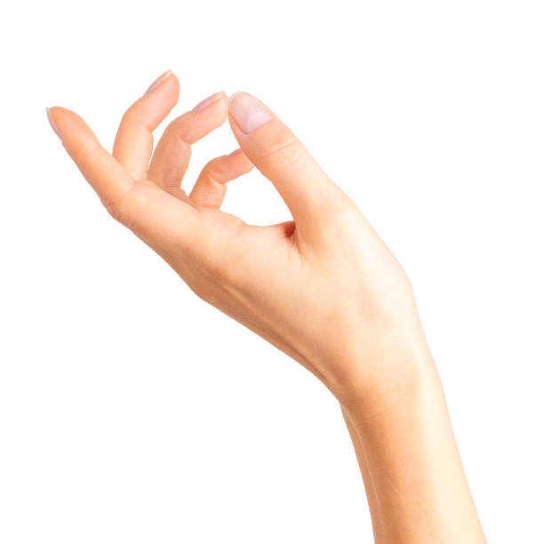 istock Woman hand holding something with two fingers 1064901924