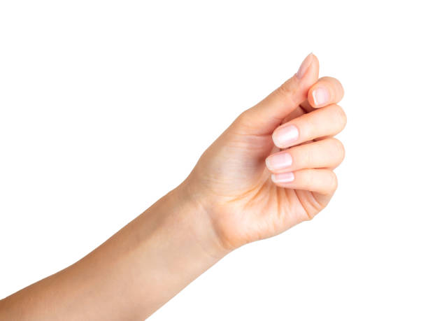 istock Woman hand holding something with three fingers 1064903206