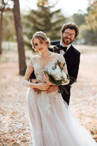 istock Bride and groom embracing 1064903476