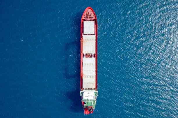 General cargo ship at sea - Aerial image General cargo ship at sea - Aerial imageGeneral cargo ship at sea - Aerial image bulk carrier stock pictures, royalty-free photos & images