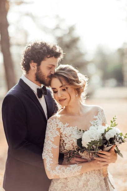 istock Bride and groom embracing 1064904510