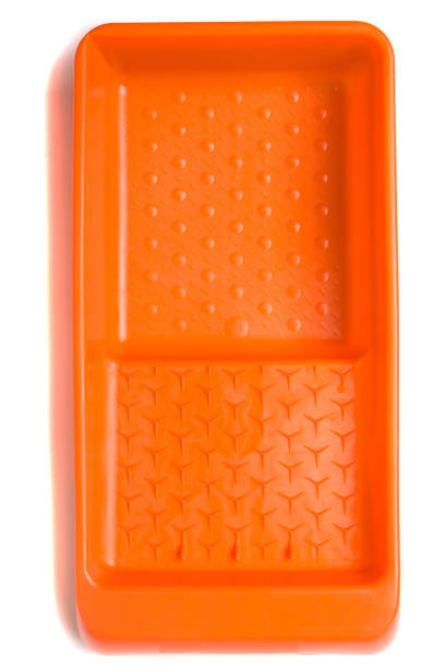 istock Orange plastic paint tray isolated in white background 1064909040