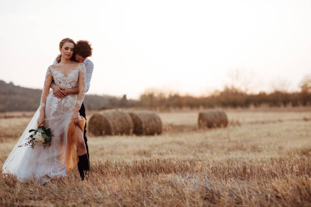 istock Beautiful bride and groom at sunset 1064909570