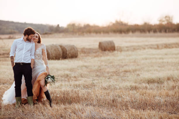 istock Beautiful bride and groom at sunset 1064909592