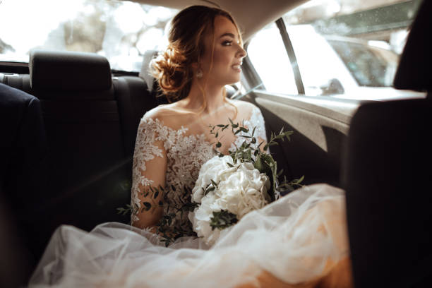 istock Bride sitting in the backseat 1064911520