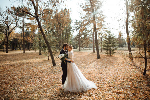 istock Beautiful wedding couple in park. 1064911770
