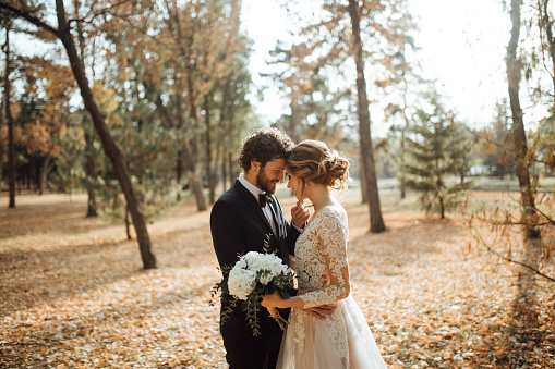 Beautiful wedding couple in park.