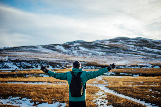 istock Young man arms outstretched for happiness in Iceland 1064913564