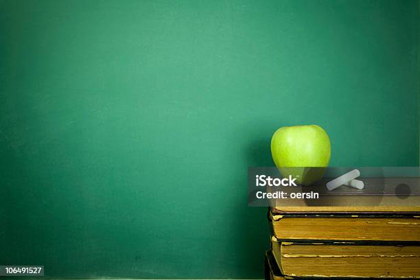 Green Apple And Chalk Sitting On Education Books Stock Photo - Download Image Now - Apple - Fruit, Back to School, Book