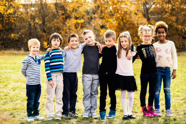 istock Happy kids running on meadow 1064915422