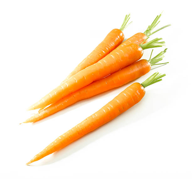 istock Five shiny carrots isolated against white background 106491776