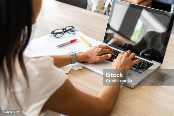 Businesswoman Typing On Laptop At Workplace Woman Working In Home Office Hand Keyboard Stock Photo - Download Image Now