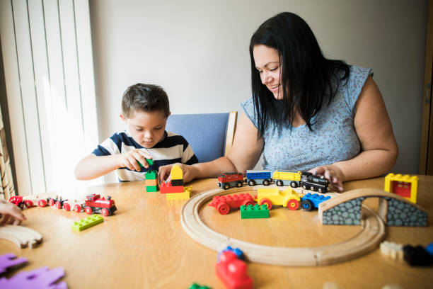 istock Mother and son playing together at a table 1064921086