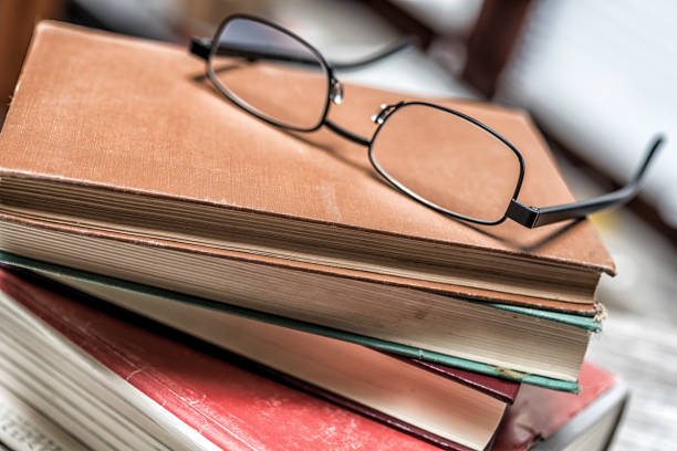 istock Books with glasses on wooden table 1064922978