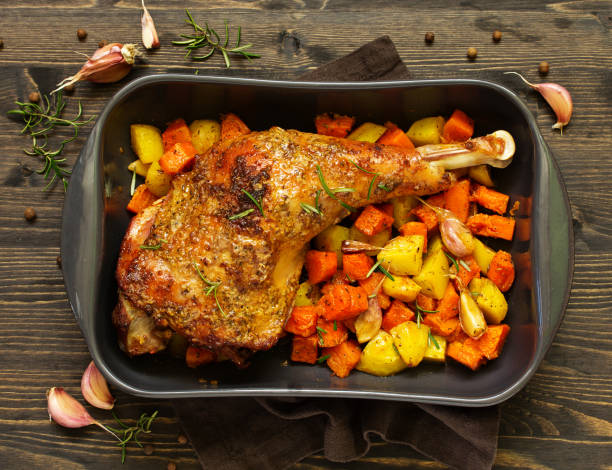 istock baked turkey thigh with vegetables. 1064922986
