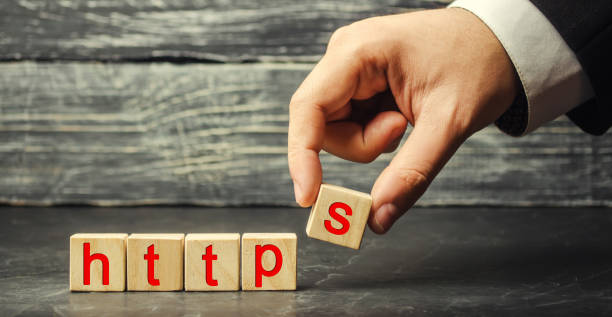 istock Hand holds a cube with the letter S with the word http. Changing the protocol for security and transfer of hypervistext, increasing the security of websites. Certification of security on the Internet 1064922992