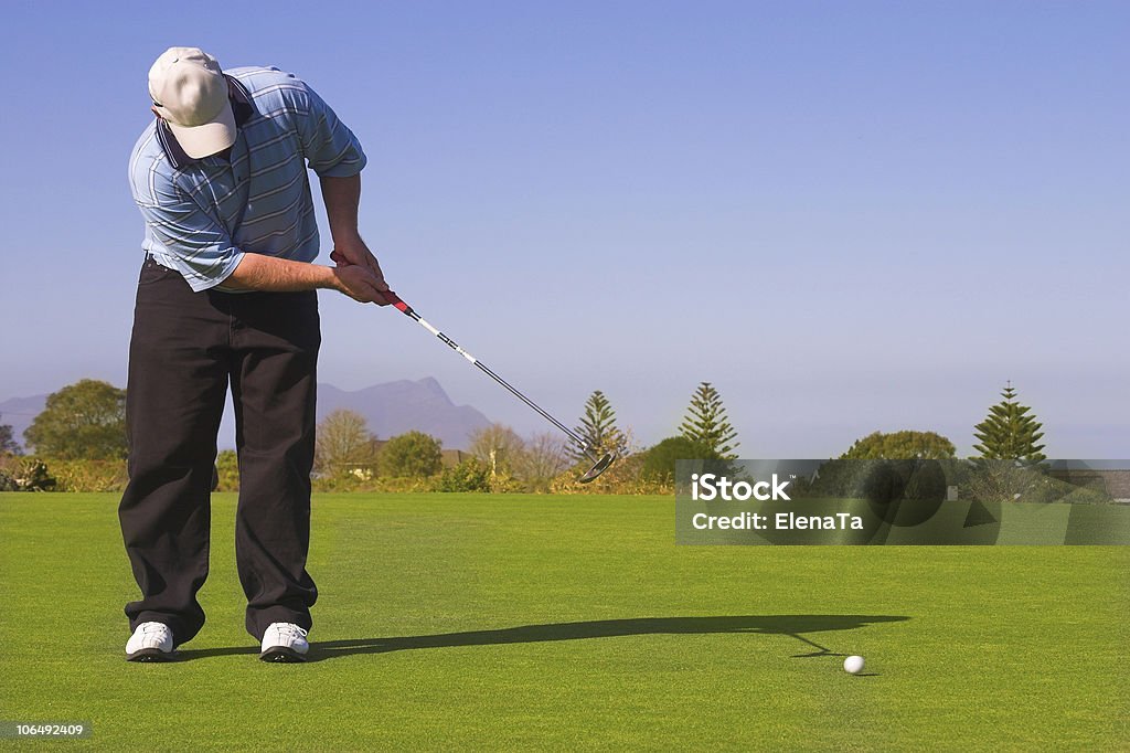 Golfista na zielony - Zbiór zdjęć royalty-free (Czapka)