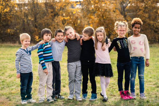 istock Happy kids running on meadow 1064924300
