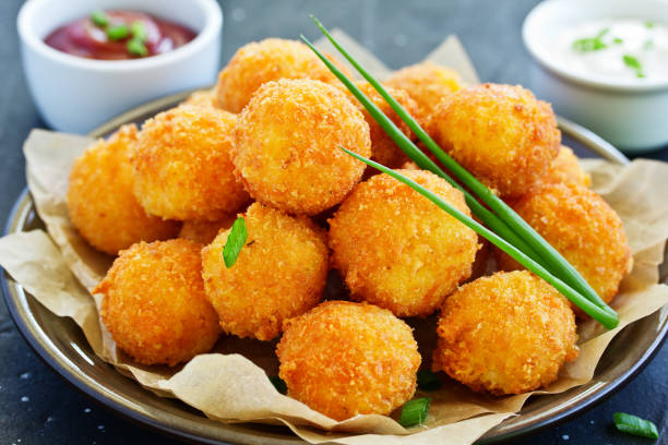 istock cheese balls with tomato sauce. 1064925544