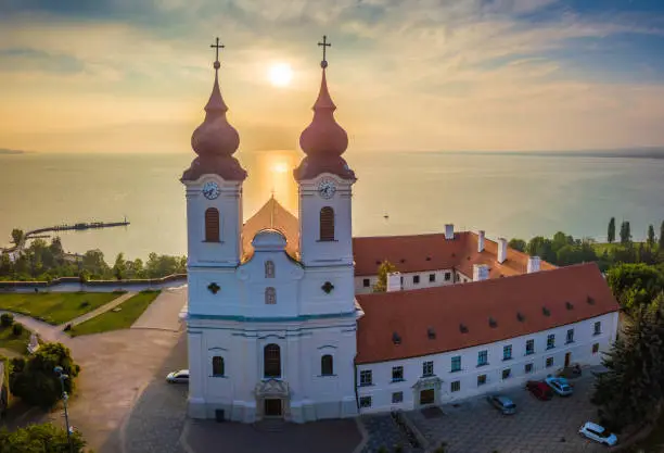 Tihany, Hungary - Aerial panoramic view of Benedictine Monastery of Tihany (Tihany Abbey) at sunrise with Lake Balaton at background