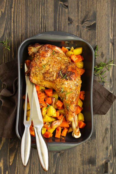 istock baked turkey thigh with vegetables. 1064926382