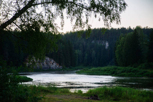 istock Natural background, landscape: sunset on a forest river on a Sunny day, evening fog. 1064928672