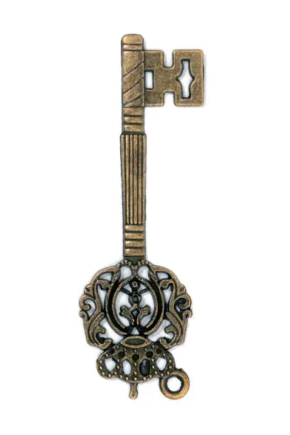 vintage fantasy detailed golden key isolated on a white background.