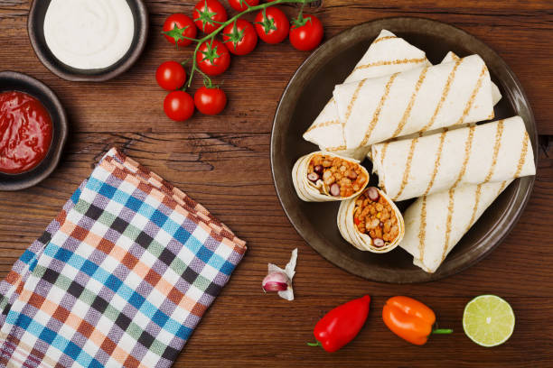 istock Burritos wraps with meat, beans and vegetables. 1064929238