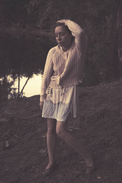 istock Sad woman on the lake. 1064929578