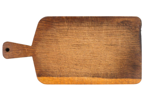 istock Wooden cutting board isolated on white background. Top view. 1064932038