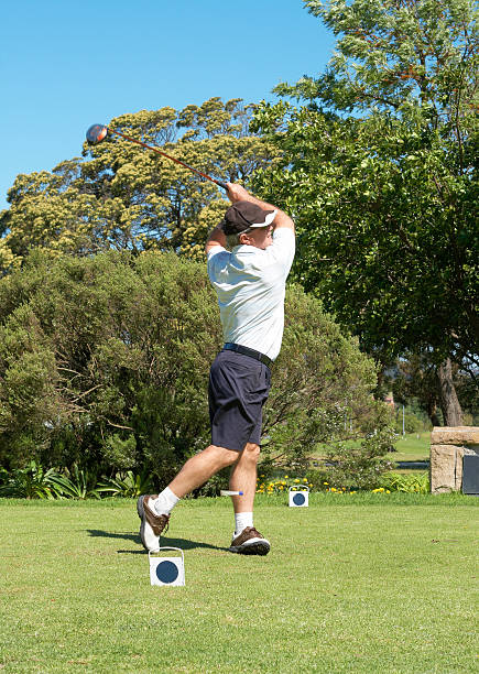 istock Senior golfer hitting the ball on golf course 106493778