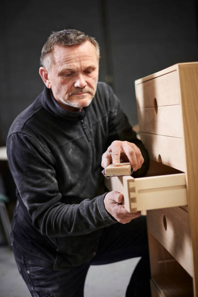 istock Working cabinetmaker and handmade furnitures 1064938042