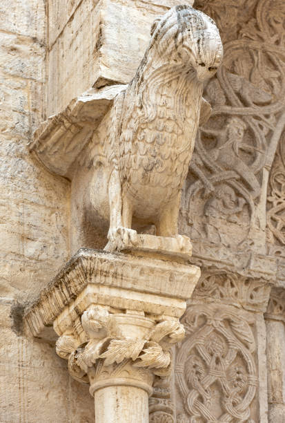 istock protome cathedral Bisceglie (Apulia) ITALY - decorative element in an arch stone ornament 1064938530