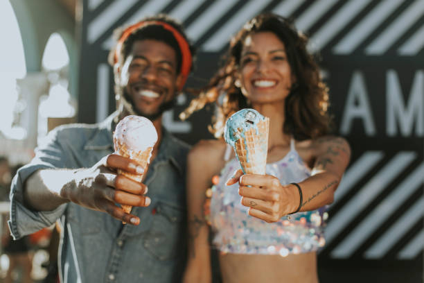 Cheerful couple enjoying ice cream