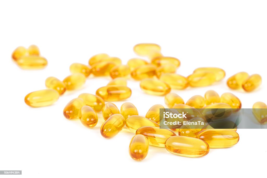 Giallo vitamina E pillole - Foto stock royalty-free di Alimentazione sana
