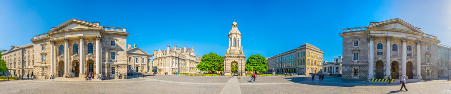 Dublin, Ireland, May 9, 2017: Students are passing the Campanile inside of the trinity college campus in Dublin, ireland