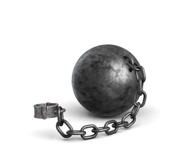 Photo of 3d rendering of a lying iron ball attached to a shackle with a strong chain.
